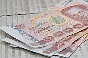 Thousand baht notes on stock quotes