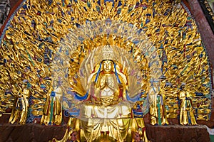 Thousand hands Buddha statue at Bao Ding at Dazu Rock Carvings photo