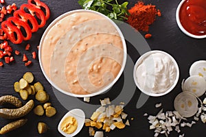 Thousand Island Dressing with ingredients close-up. horizontal t