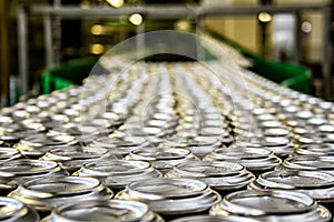 Thousands of beverage aluminum cans on conveyor line at factory