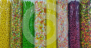 Thousands of colorful candies in plastic tubes