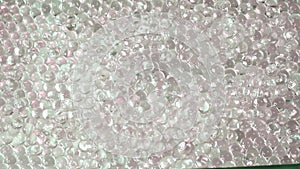 Thousands of hydrogel spheres crowd together, a macro universe of clarity and repetition, perfect for background or