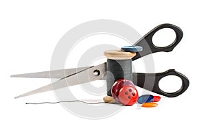 Thread bobbin, scissors and buttons