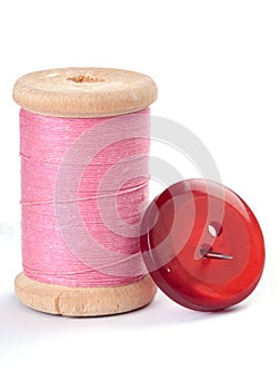 Thread and a button with a needle