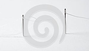 A Thread of Connection Between Two Needles