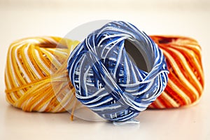 Thread rolls in blue red and yellow