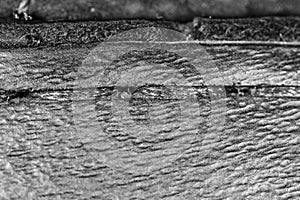 Thread seam on black leather material as background