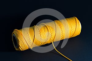 Thread spool with yellow thread