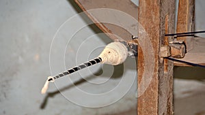 Thread on a wooden spinning wheel in an artisanal shop