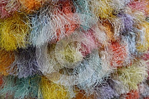 A threads, close-up, multi-colored threads of colored delicate rainbow yarn.