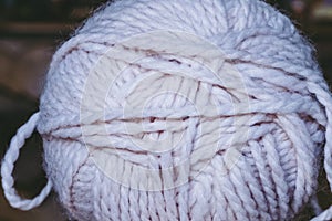 Threads of pink yarn for knitting