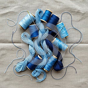 Threads range from light to dark blue, creating a gradient effect