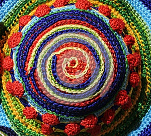 Threads woven together to form a colored spiral