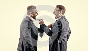 threatening business reputation. rival company threatening. businessmen threaten business men isolated on white photo