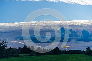 Threatening cloud formations  in the sky from the coming storm, while the blue of the sky is still visible