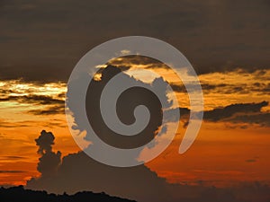 Threatening Cumulus clouds that start to evolve thunder clouds.  Sunset. Thailand, Phuket. Storm coming concept