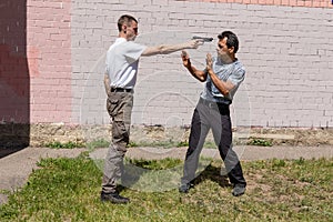 Threatening with weapons on the street.