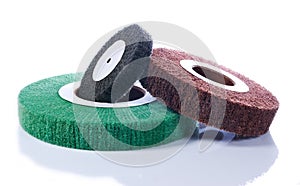 Three abrasive wheels