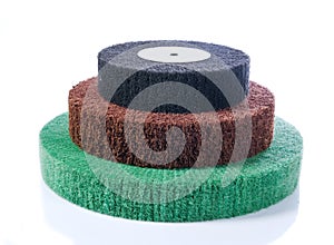 Three abrasive wheels