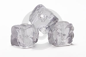 Three acrylic ice cubes, white background