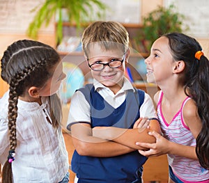 Three adorable schoolchildren having fun