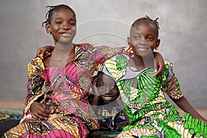 Three African black Children Smiling and Laughing together