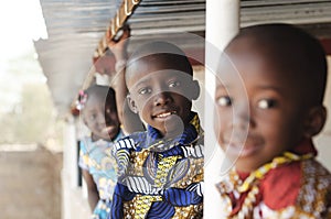 Three African Children Smiling and Laughing outdoors