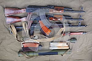 three ak 47 on canvas with ammunitions on canvas