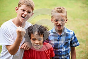 The three amigos. Portrait of a three little boys standing outside.