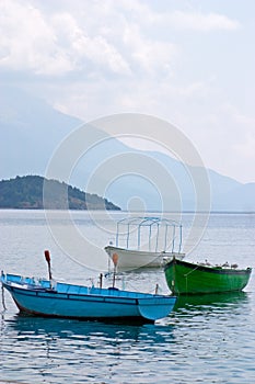 Three anchored boats