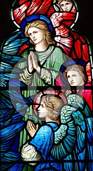 Three angels (praying) in stained glass