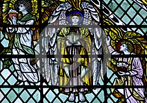 Three angels in stained glass