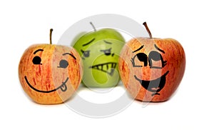 Three apples with cartoon faces isolated