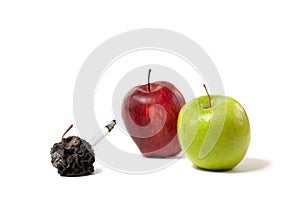 Three apples: fresh, rotting and dead