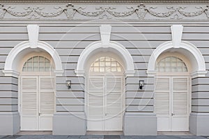 Three arched doors in historic buildings photo