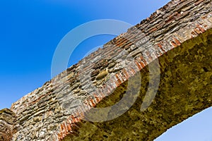 three archs medieval humpback bridge in Italy