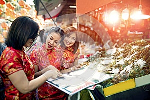 Three asian woman wearing chinese tradition clothes happiness touring in yaowarat road one most popular traveling and famous