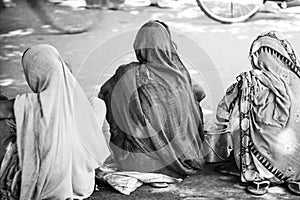 Three asian women with covered heads