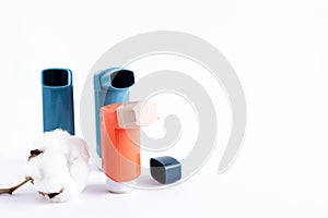 Three asthma inhalers on an isolated white background. Medical concept
