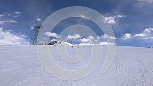 Three Athletes Ski from the Hill in a Synchronized Manner in the French Alps