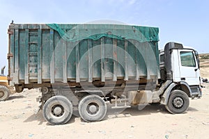 Three axle hook lift truck