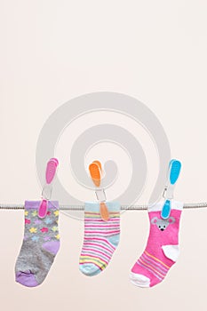 Three Babies Socks Hung To dry