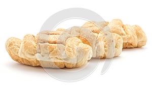 Baked croissant isolated on white photo