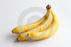 Three bananas on a white background.