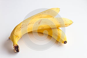 Three bananas on a white background.