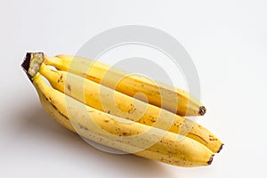 Three bananas on a white background.