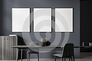 Three banners in the dark grey living room with table and sideboard