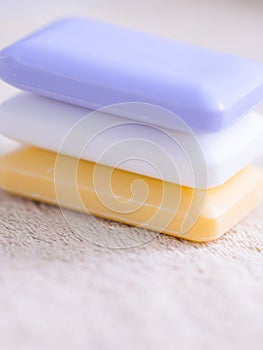 Three bars of soap on a towel