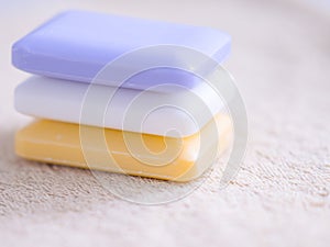 Three bars of soap on a towel