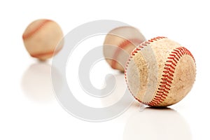 Three Baseballs Isolated on Reflective White